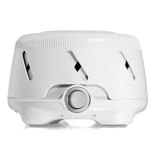 Yogasleep Dohm Uno white noise sound machine on a nightstand