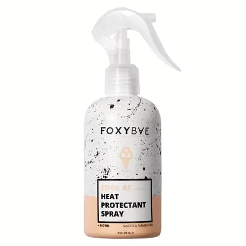 Pink bottle of FoxyBae Heat Protectant Spray for thermal styling