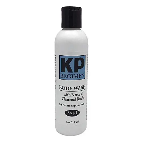 KP Regimen Exfoliating Face and Body Wash with natural charcoal beads in a bottle.
