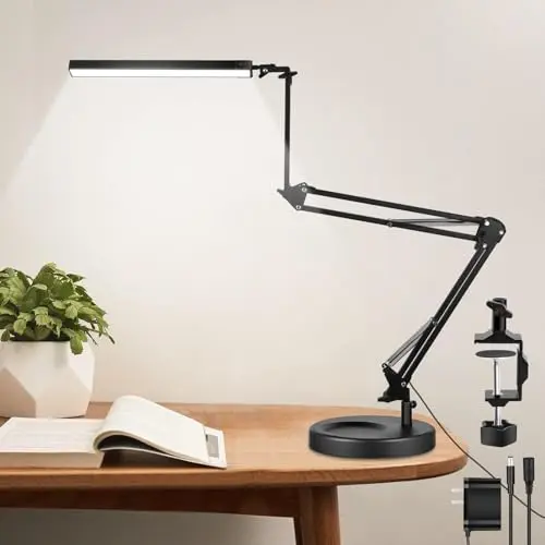 NOEVSBIG tall black swing-arm architect lamp with a clamp and base, extended over a large drafting table.