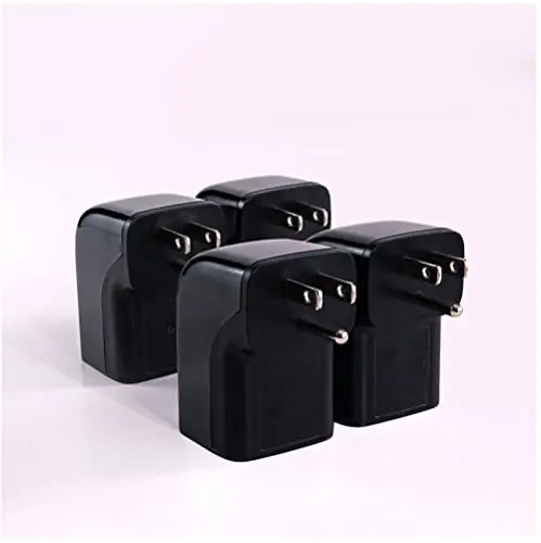 Four black compact Clamper single outlet surge protectors