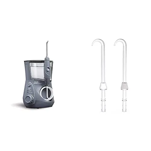 Waterpik Aquarius countertop water flosser with multiple tips on a bathroom counter