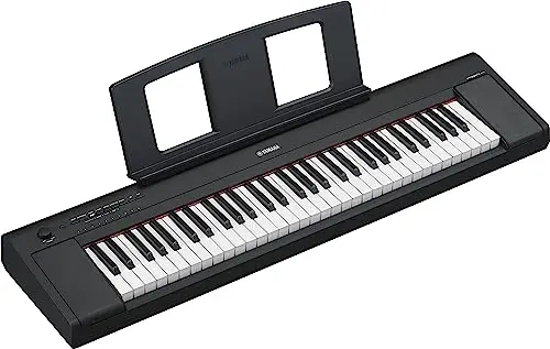 Yamaha NP15B slim portable digital piano being carried