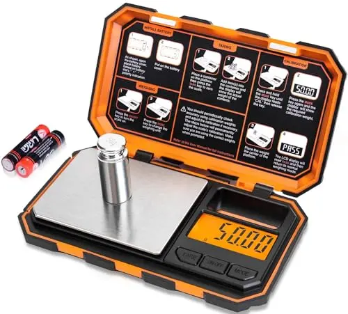 Fuzion orange digital pocket scale with calibration weight on a table