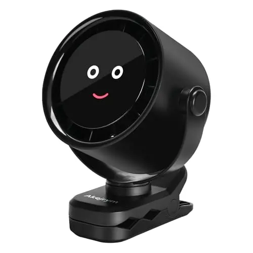 Akejrym black personal fan with digital display and smiley face light, clipped to a surface.