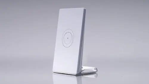 Small white mini router or WiFi extender for Starlink with a vertical stand