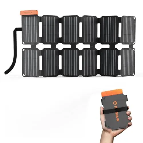 FlexSolar 36W solar panel folded with carabiner attached, next to a hiking boot on a trail